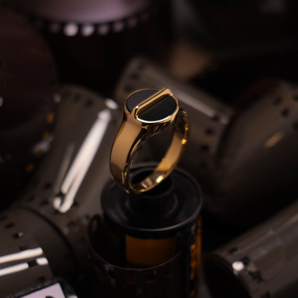 The Creator's Ring in 18k gold plated — 316L stainless steel with black onyx, made for photographers and videographers.